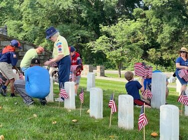 Flags placed at Alexandria National Cemetery in Alexandria, Virginia with the help of the National Capitol Area Council scouts in honor of fallen servicemembers.