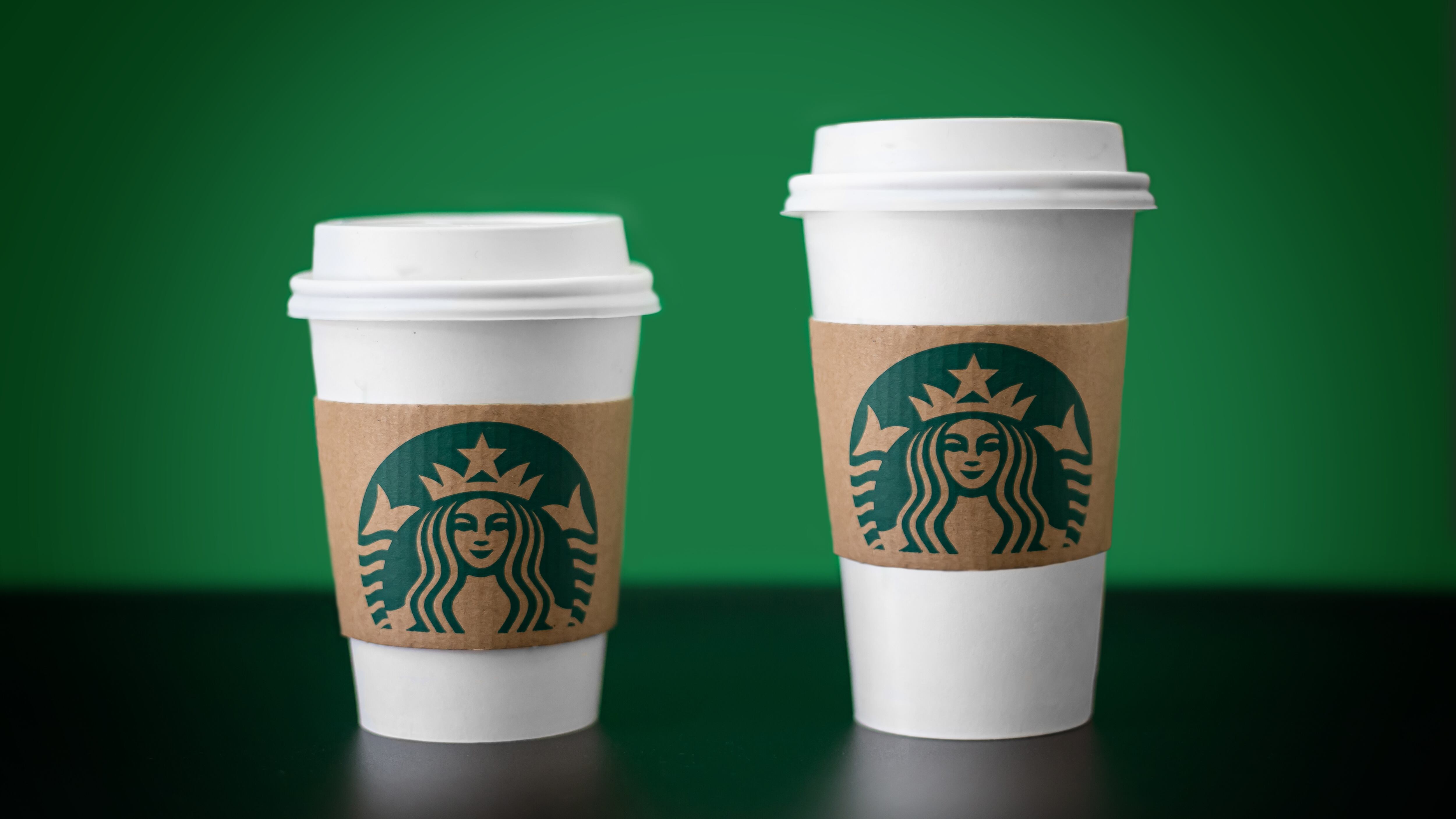 Two Starbucks cups